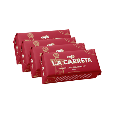 Four red Café La Carreta ground coffee brick packs, 10 oz each, fanned out